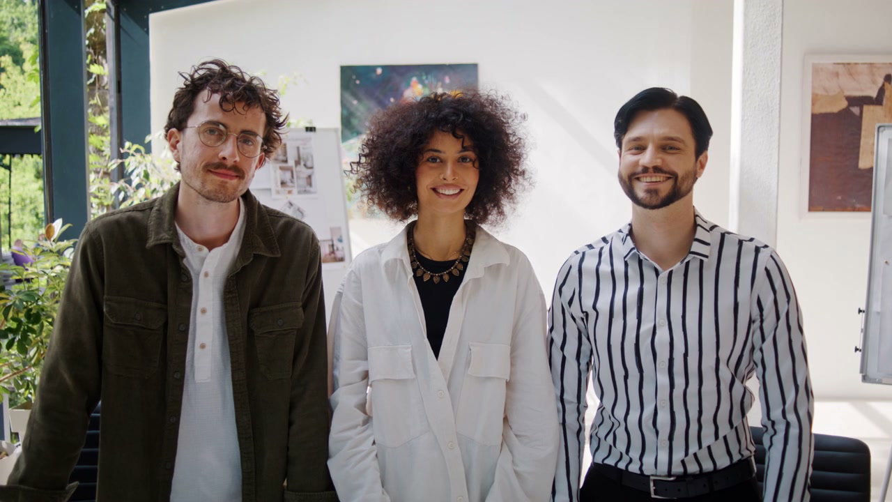 Three Business Colleagues Smiling at Camera