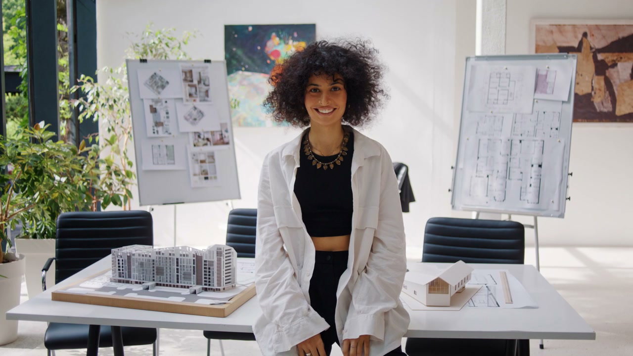 Smiling Female Architect in Modern Office