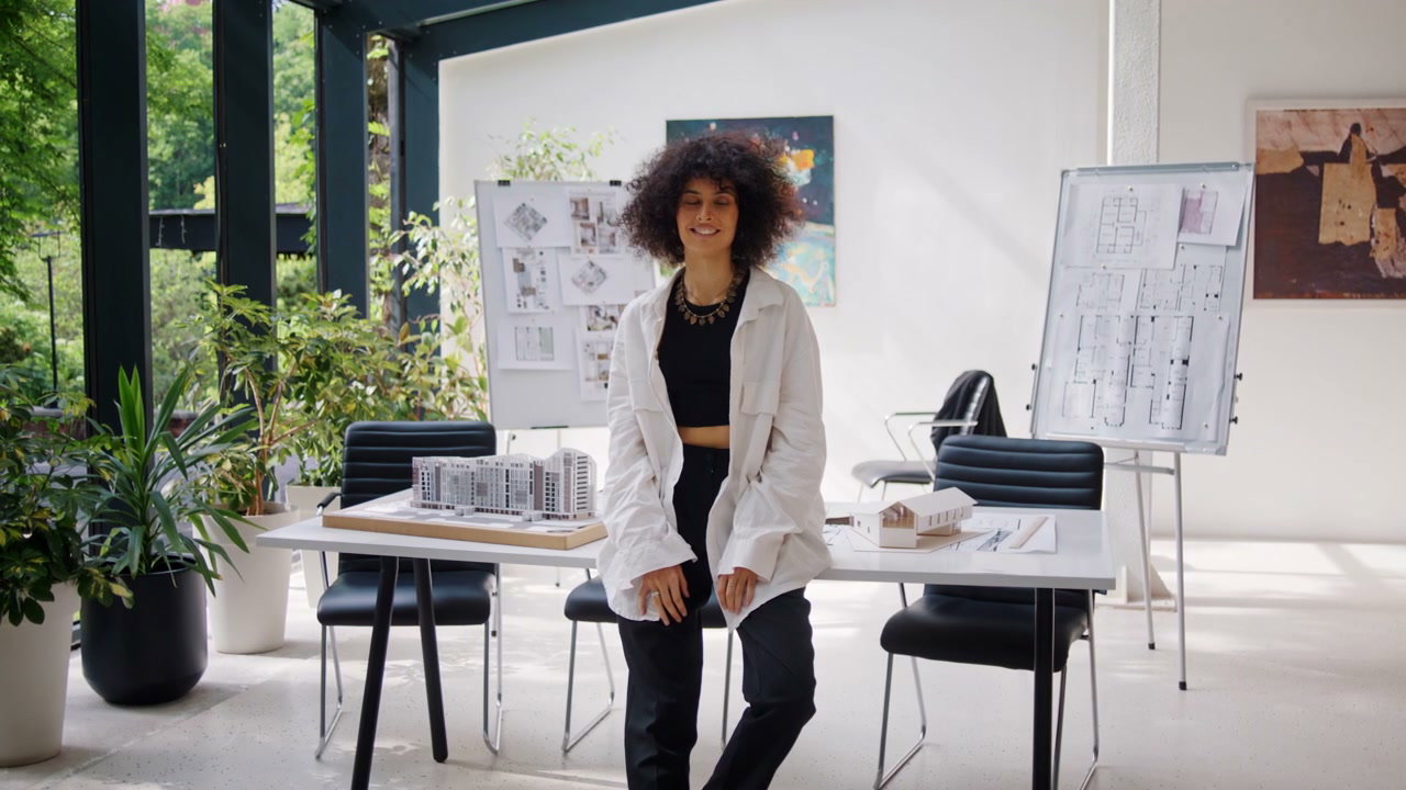 Smiling Woman Architect in Modern Office