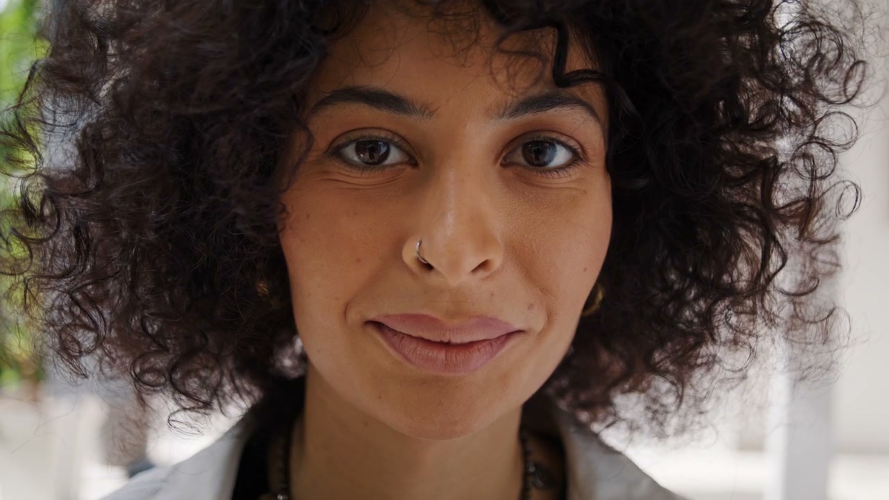 Close Up Smiling Curly Haired Woman