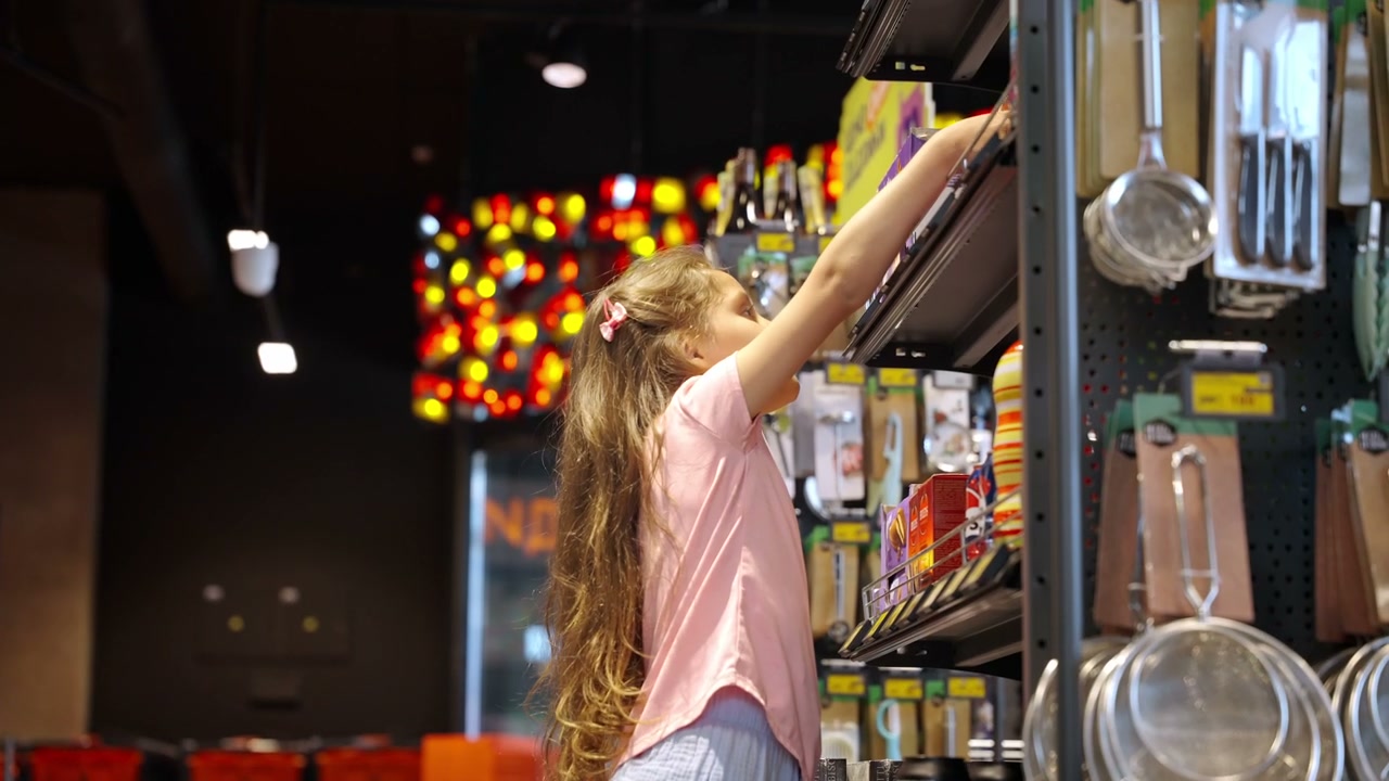 Young Girl Choosing Product in Supermarket