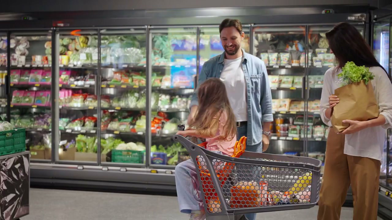Family with Daughter Having Fun Grocery Shopping