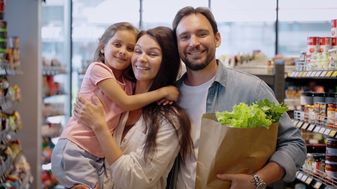 Happy Family Shopping in Grocery Store