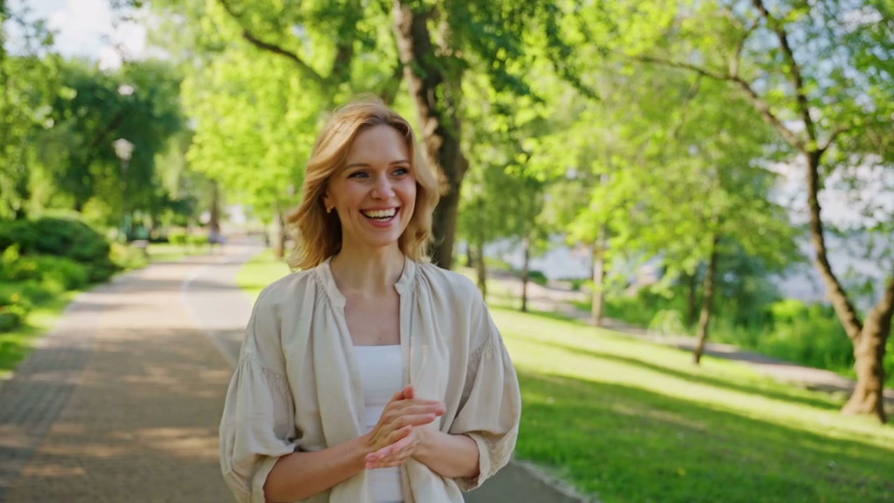 Woman Smiling in Summer Park