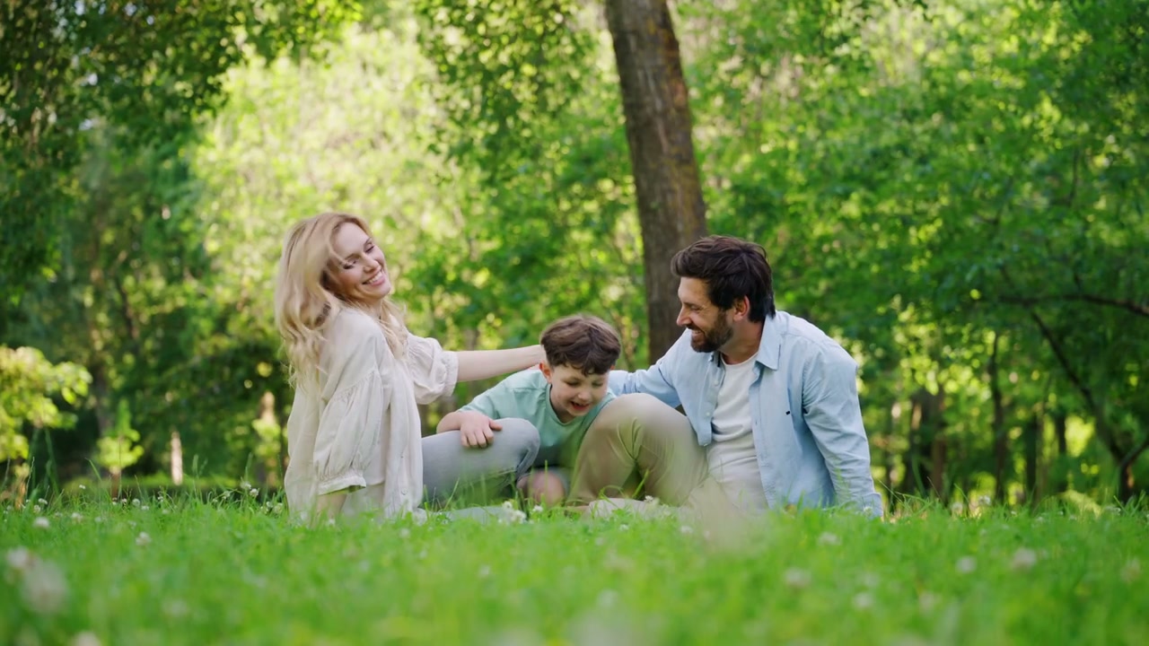 Happy Family Playing in Green Park