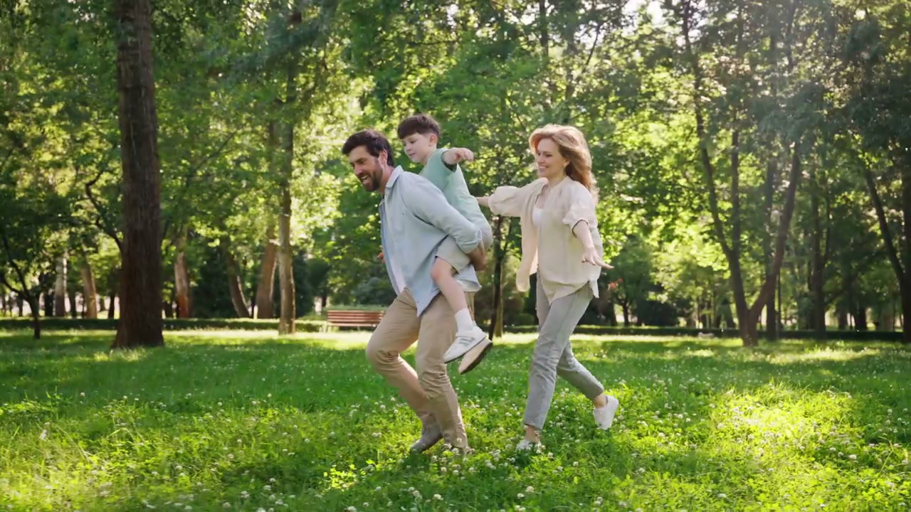 Family Playing Together in Sunny Park