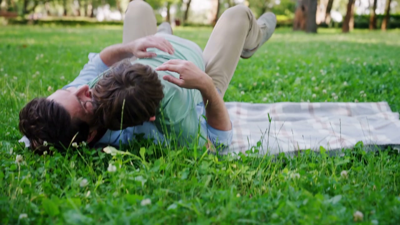 Boy Jumps Into Father's Arms In Park