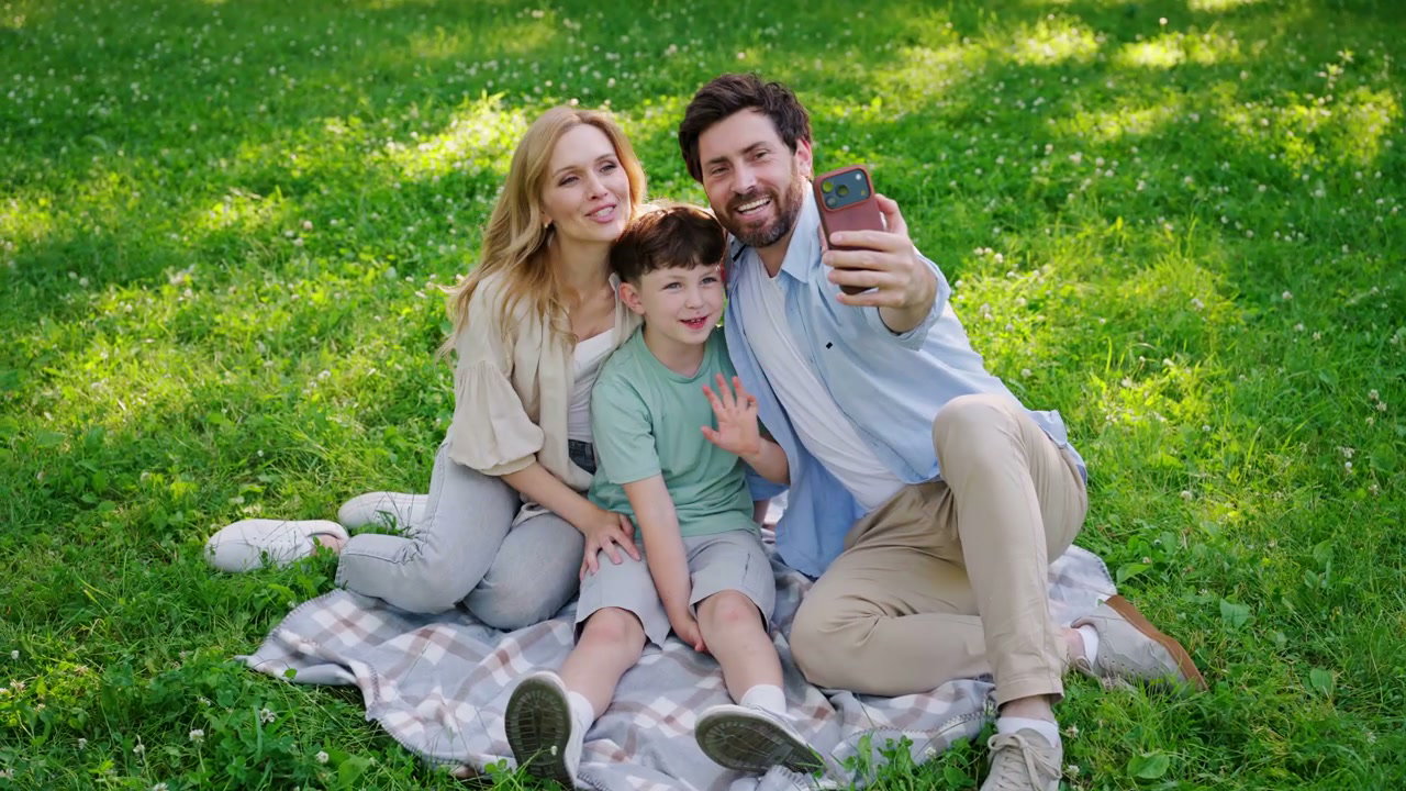 Happy Family Taking Selfie in Park
