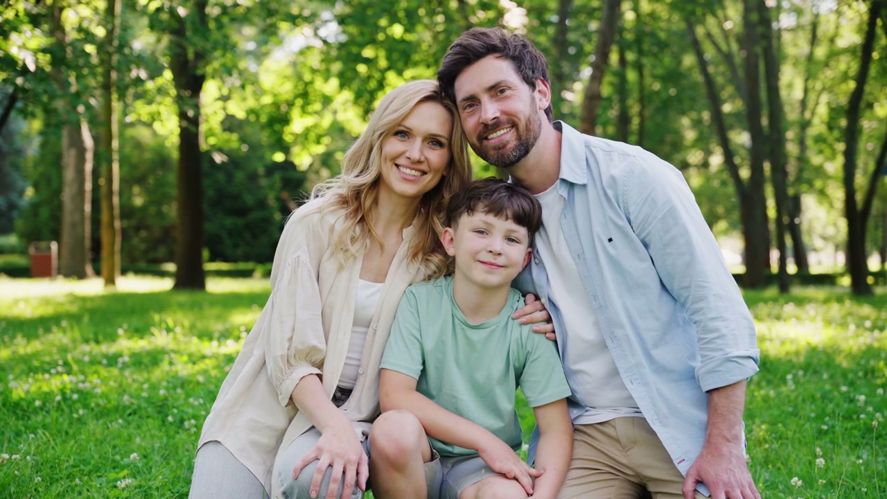 Smiling Family Portrait in a Park