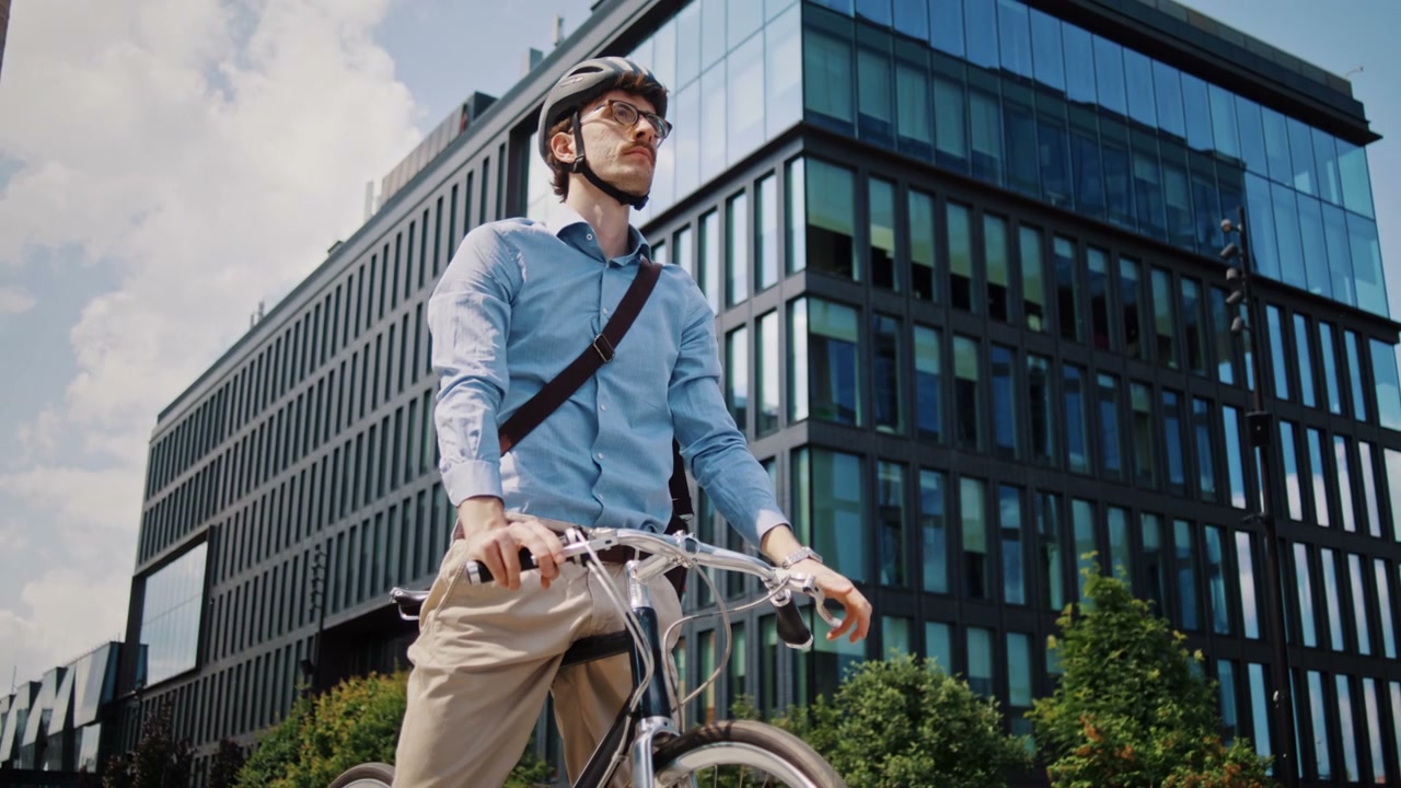 Businessman on Bike Checking Watch