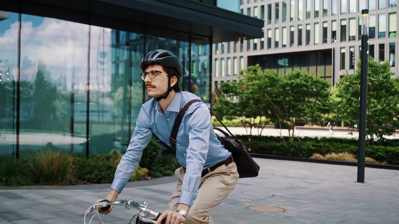 Businessman Riding Bicycle in City