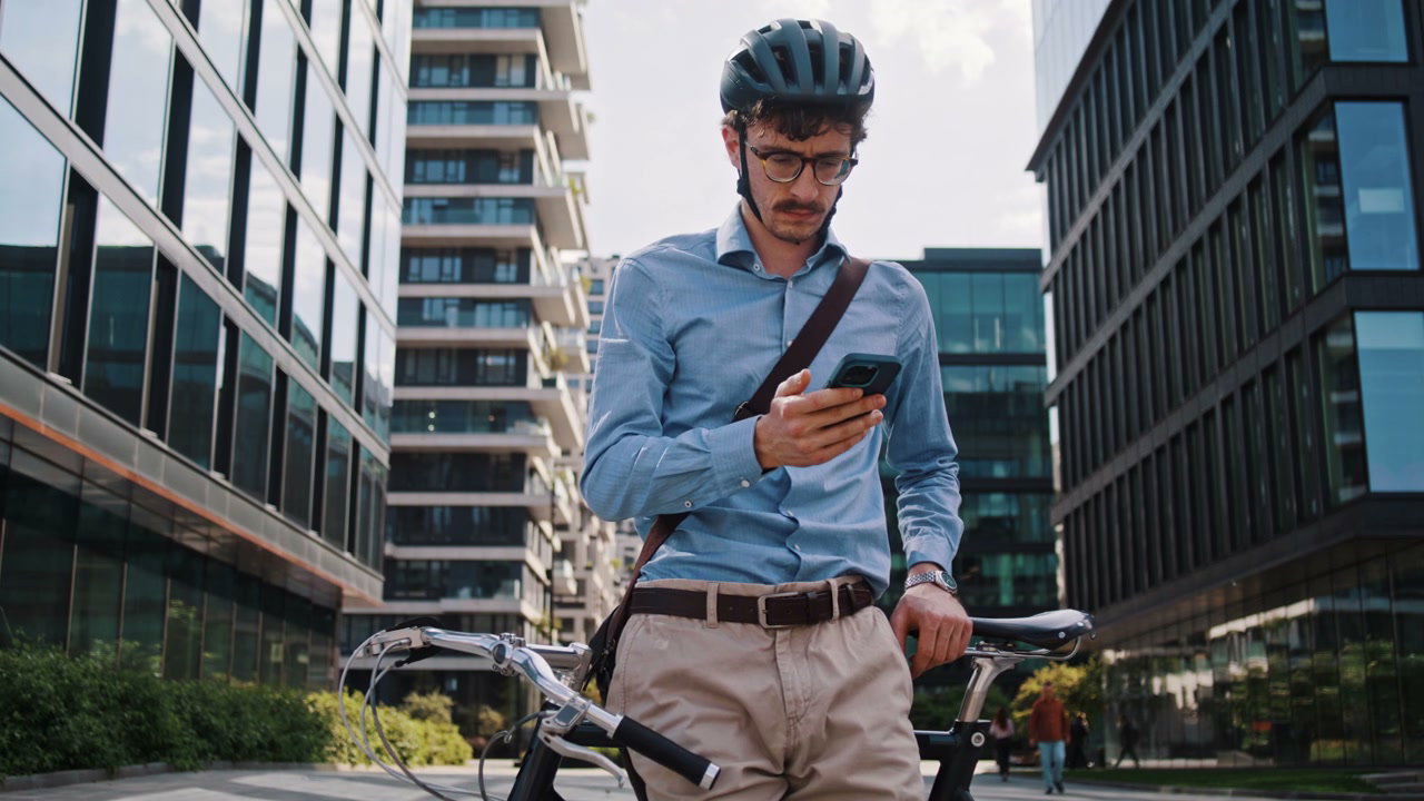 Businessman on Bike Making Phone Call