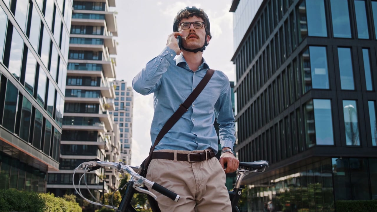 Businessman With Bike On Phone In City