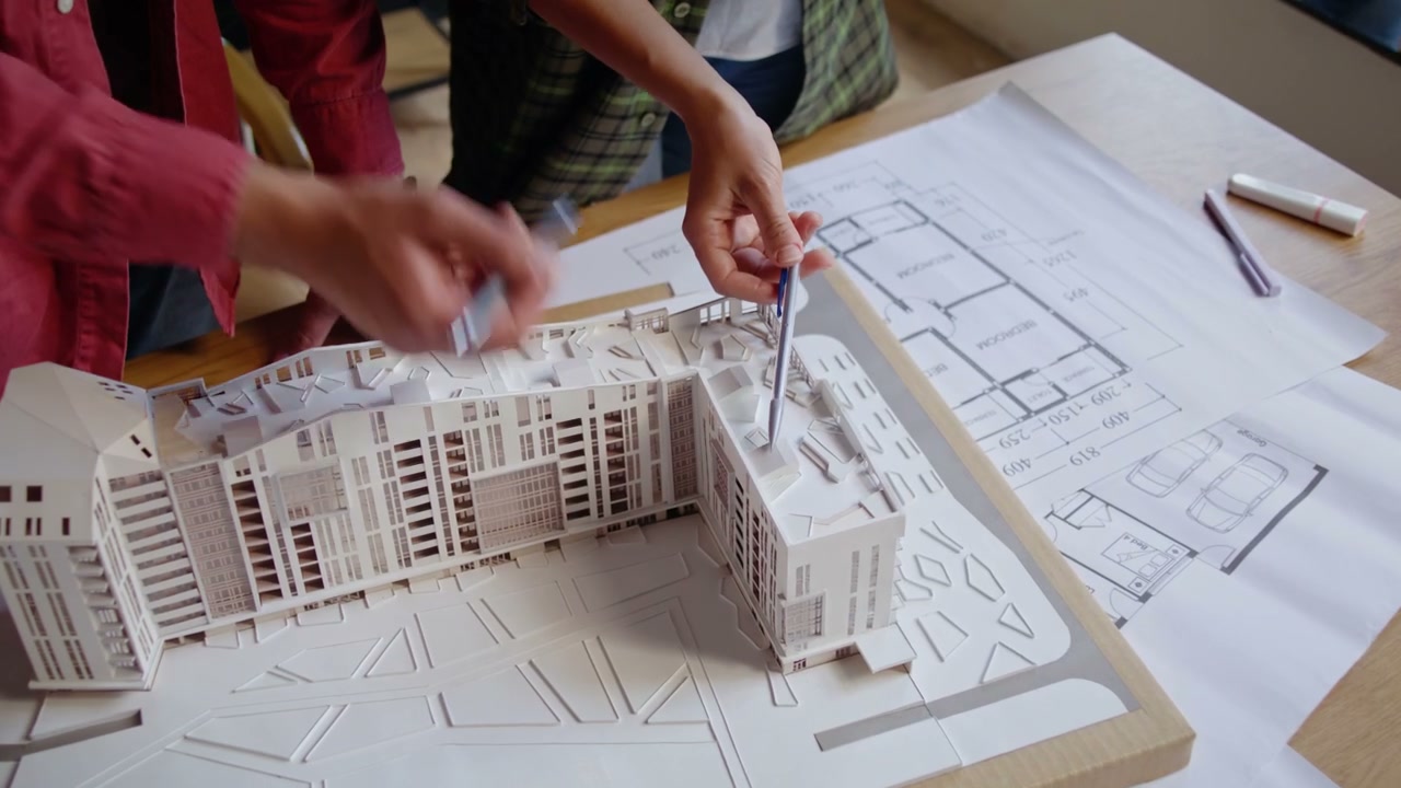 Architects Discussing Building Model
