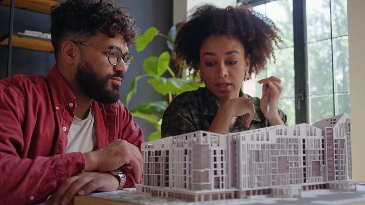 Architects Discussing Building Model