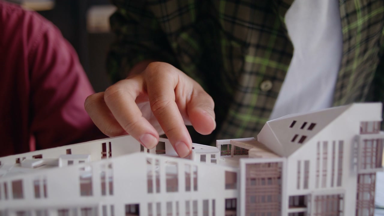 Architects Reviewing Building Model
