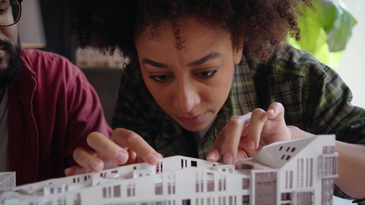 Architects Examining Building Model