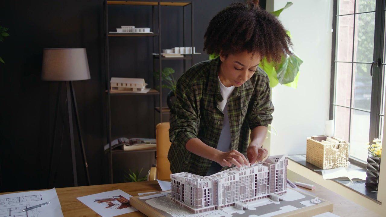Architect Inspecting Building Model