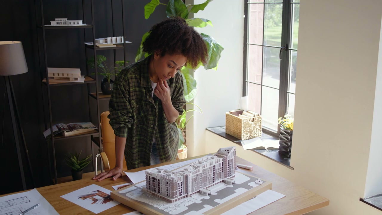 Architect Studies Building Model