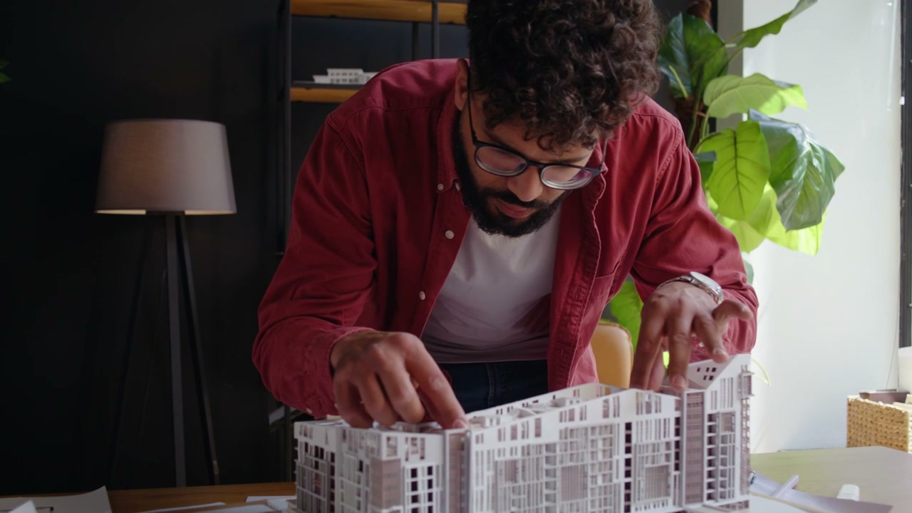 Architect Examining Building Model