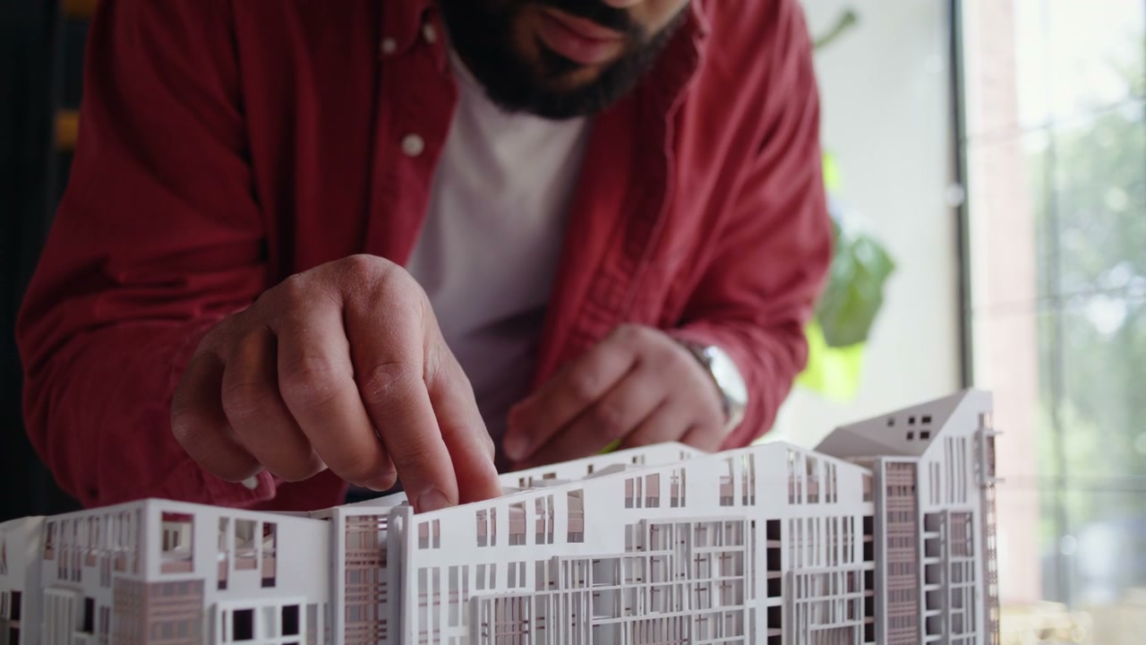 Architect Examining Building Model