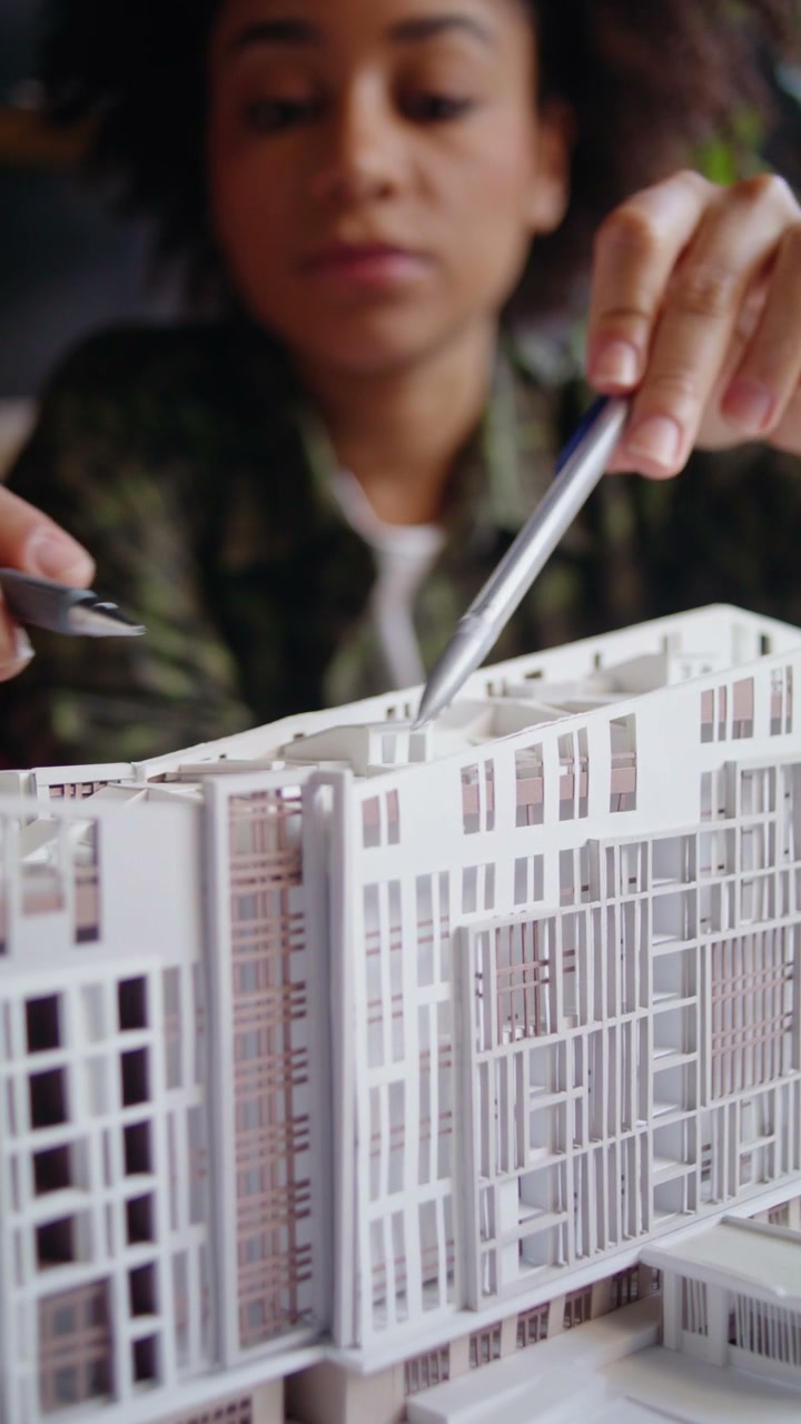 Architect Studying Building Model