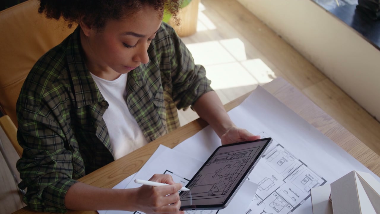 Female Architect Designing Plans on Tablet