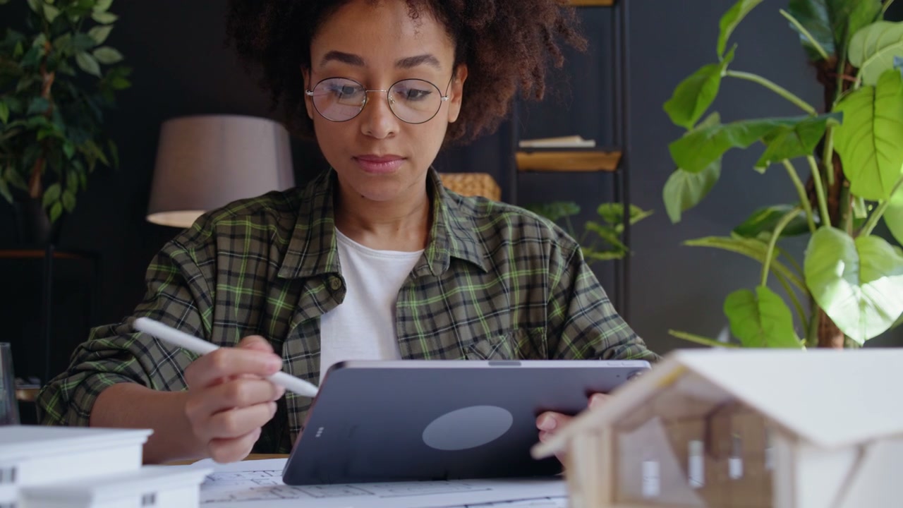 Young Architect Designing Home with Tablet