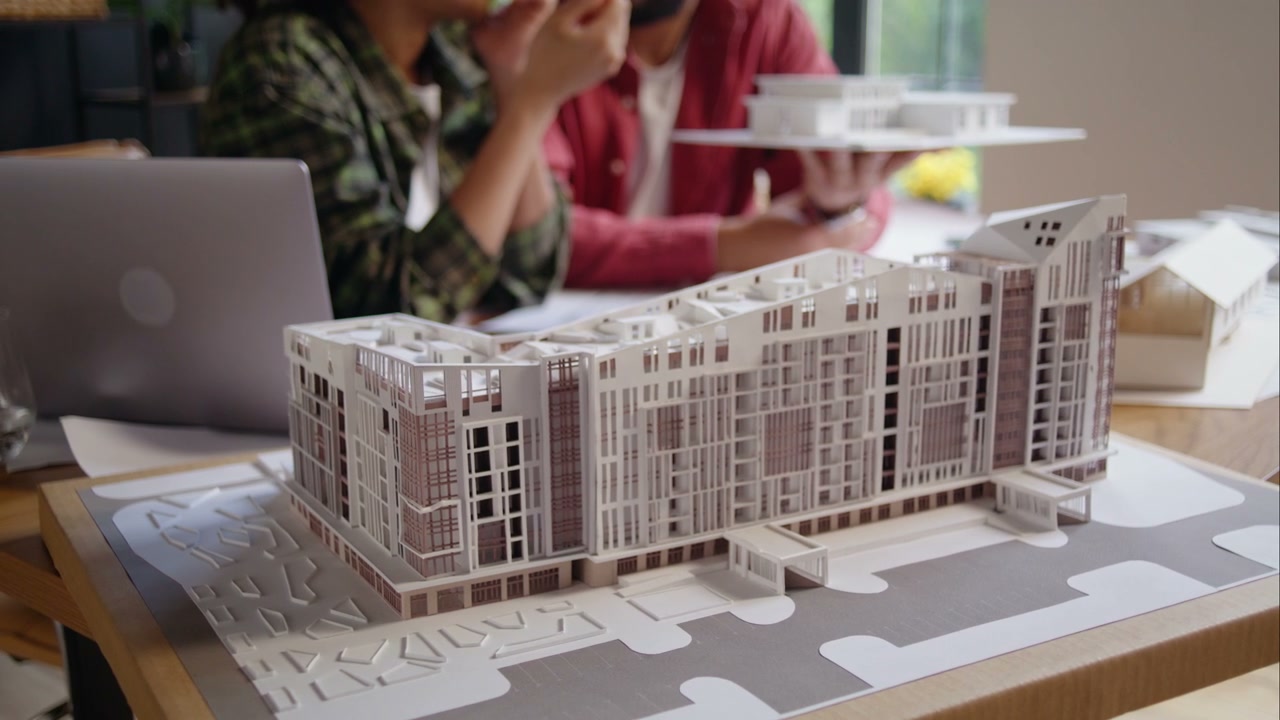 Architects Discussing Building Model