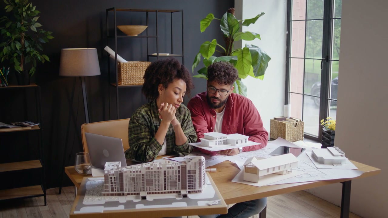 Architects Discussing Building Model