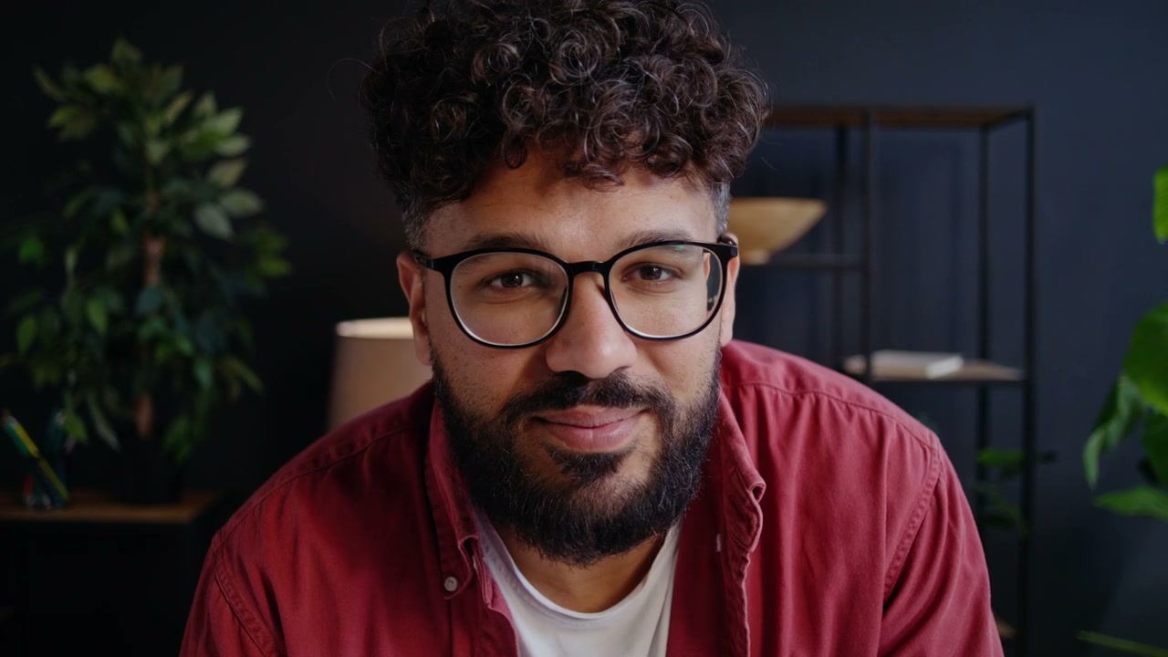 Happy Man Looking At Camera In Office