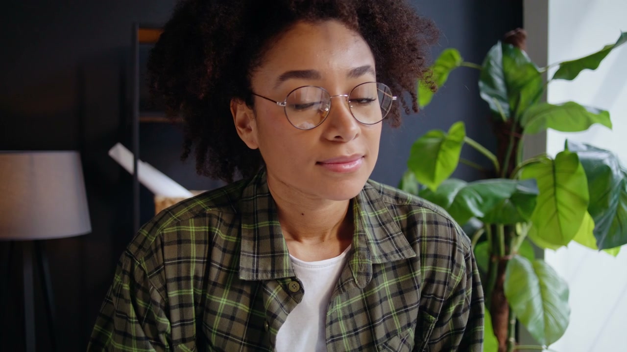Smiling Woman in Glasses Looking at Camera