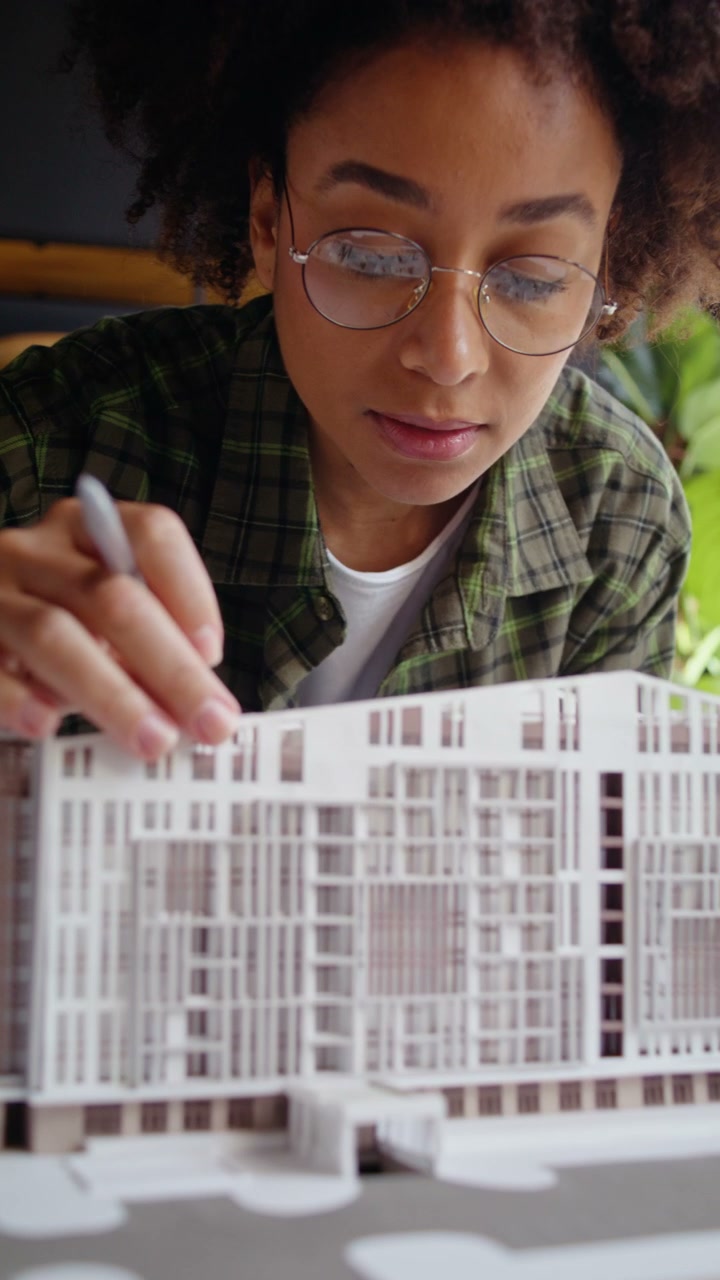 Architect Examining Building Model
