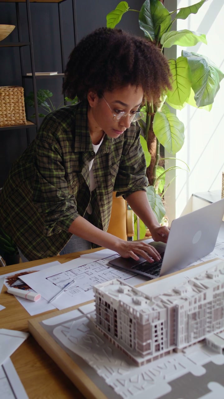 Architect Typing on Laptop in Design Studio