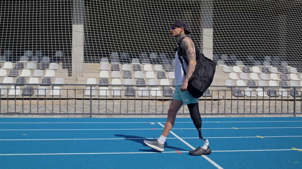 Amputee Athlete Walking on Running Track