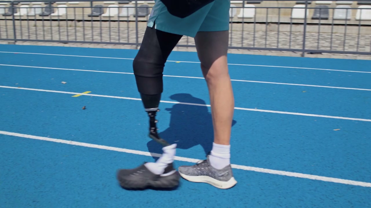 Amputee Athlete Walking on Running Track