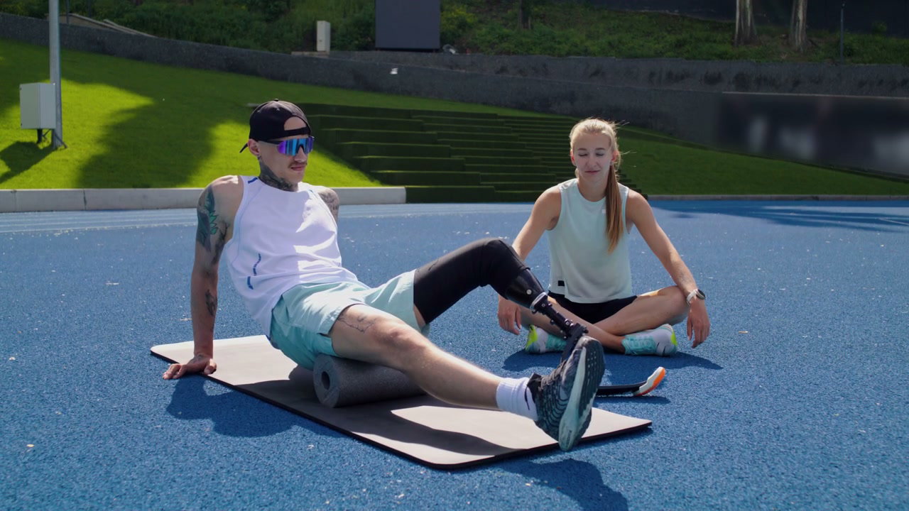 Man with Prosthetic Leg Using Foam Roller