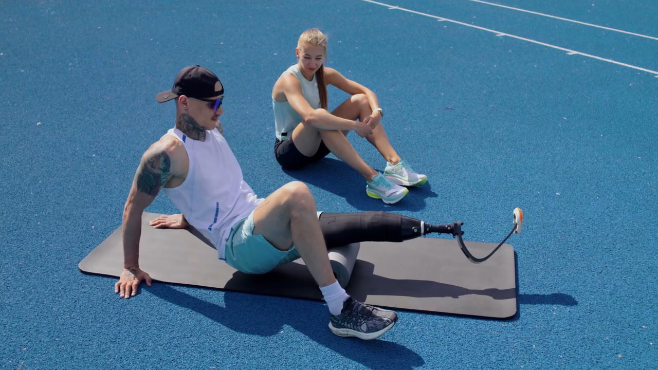Athlete with Prosthetic Leg Stretching