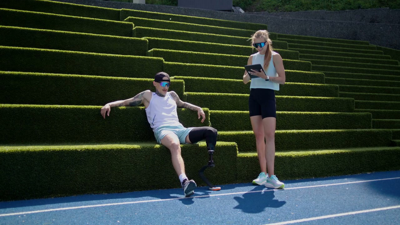 Prosthetic Runner and Coach on Track