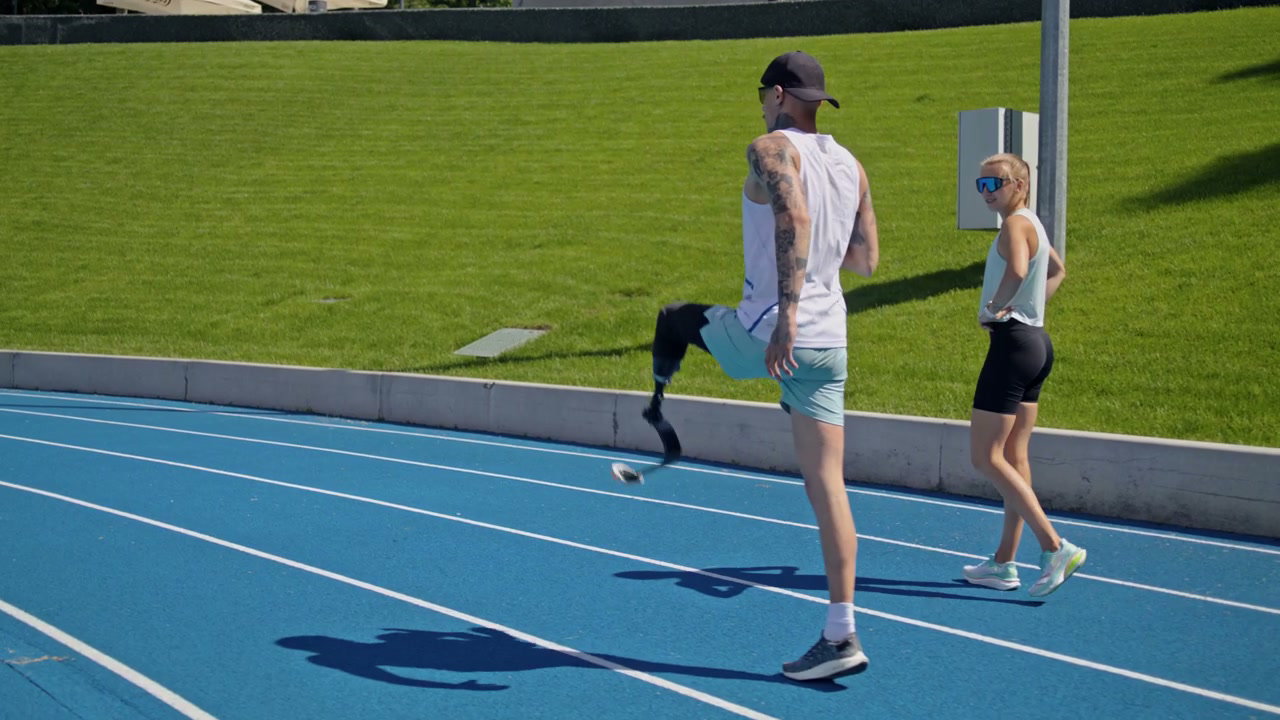 Athlete with Prosthetic Leg Warming Up