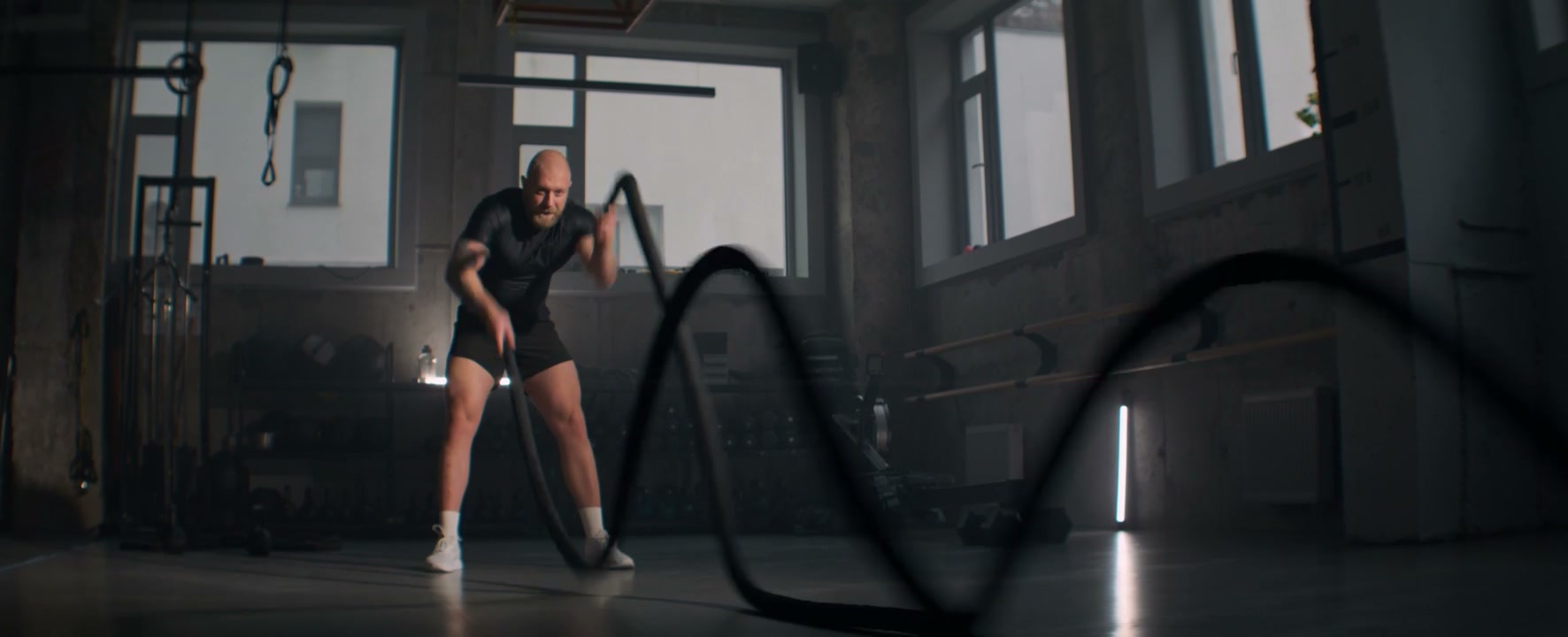 Muscular Man Working Out With Battle Ropes