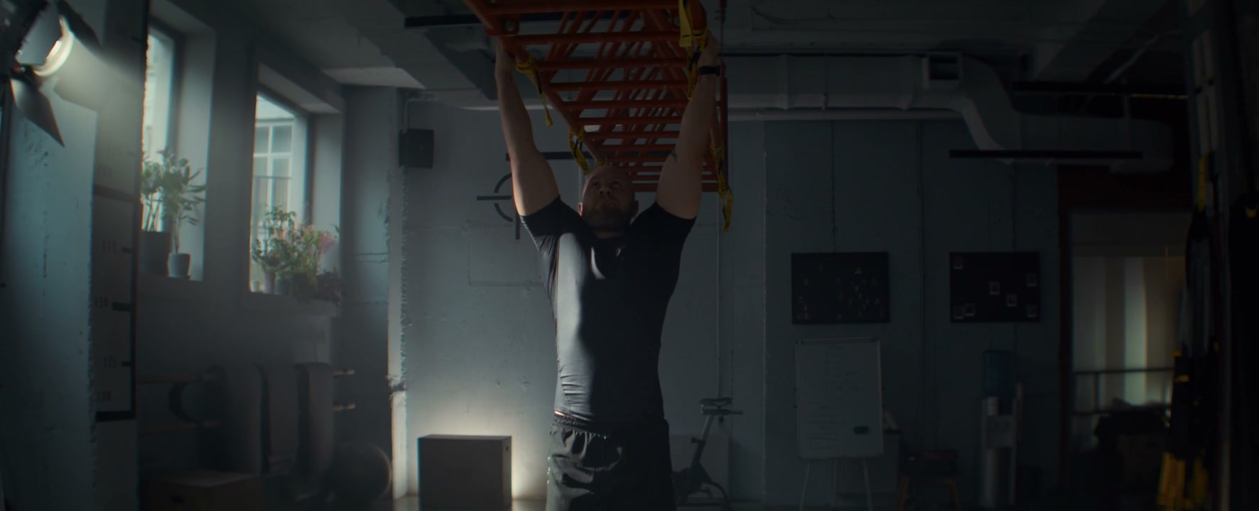 Strong Man Performs Pull-ups In Gym
