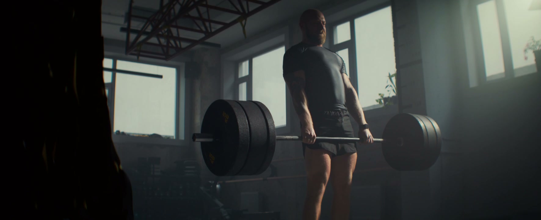 Man Performing Deadlift in Gym
