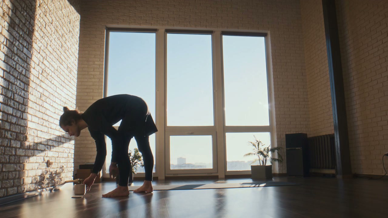 Man Practicing Yoga in Bright Studio