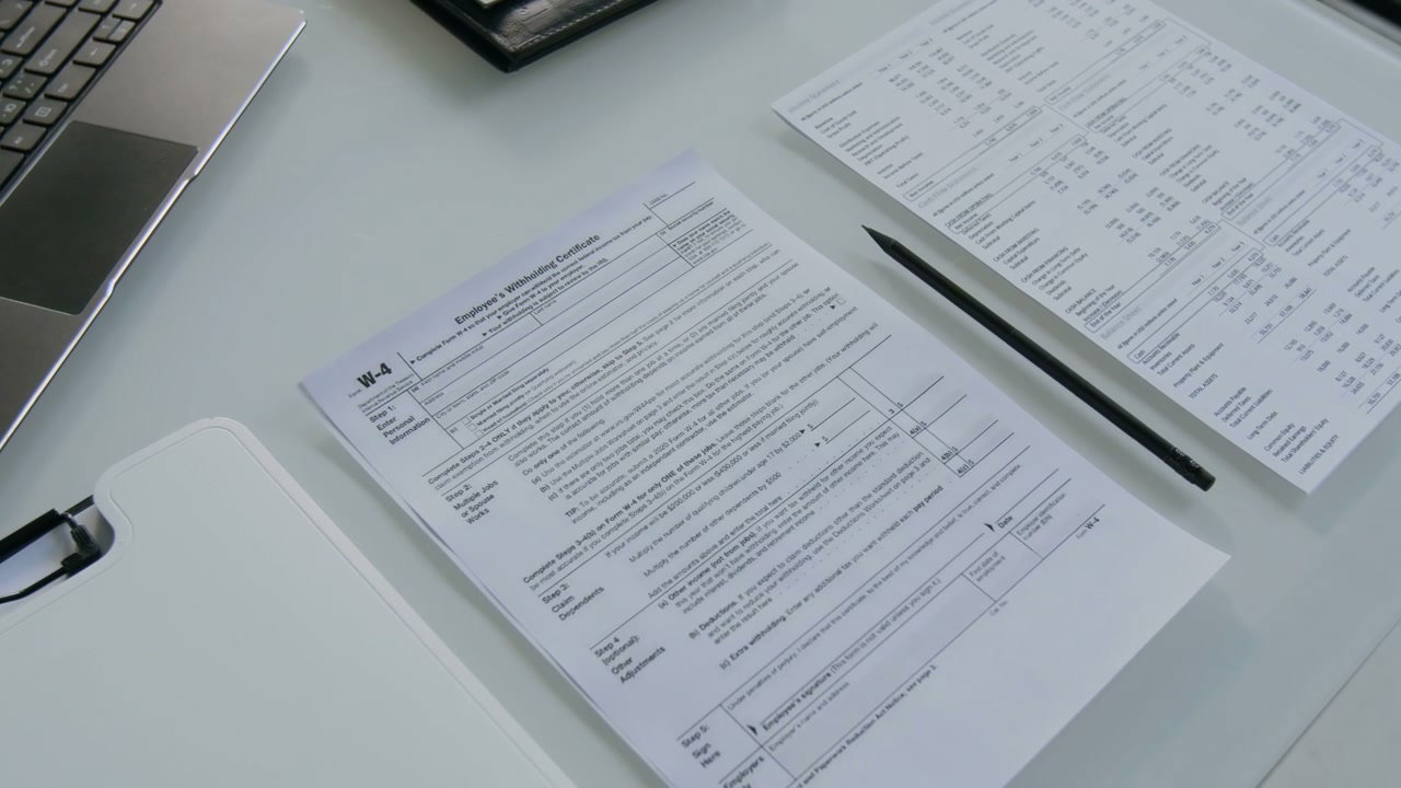 Employee's Withholding Certificate on Desk