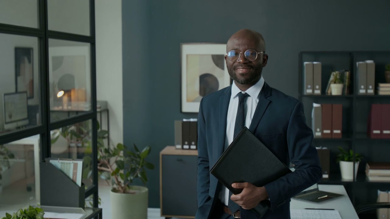 Confident Businessman Smiling in Office