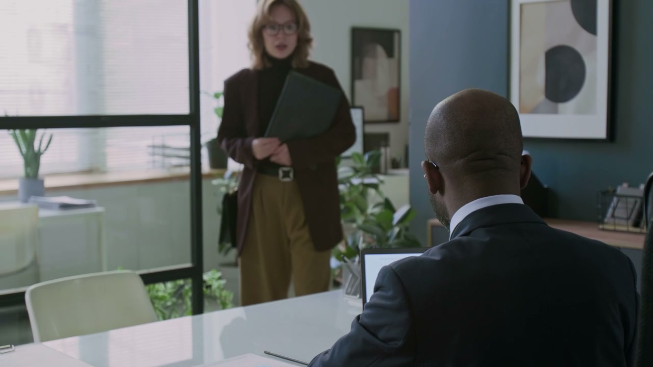 Business People Discussing Documents in Office