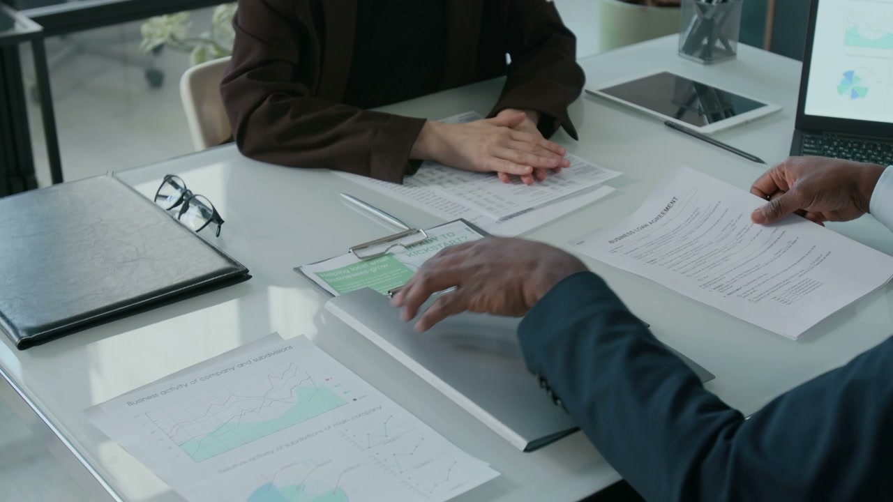 Business People Shake Hands in Office