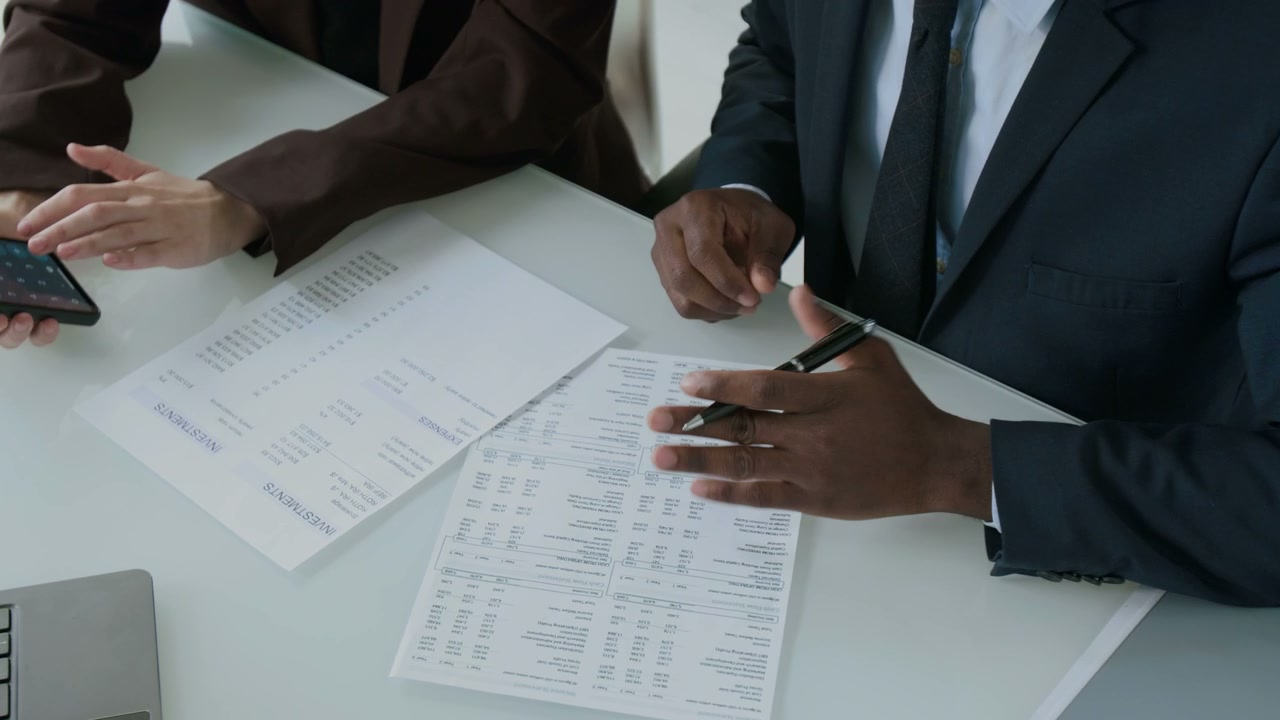 Business People Discussing Financial Documents