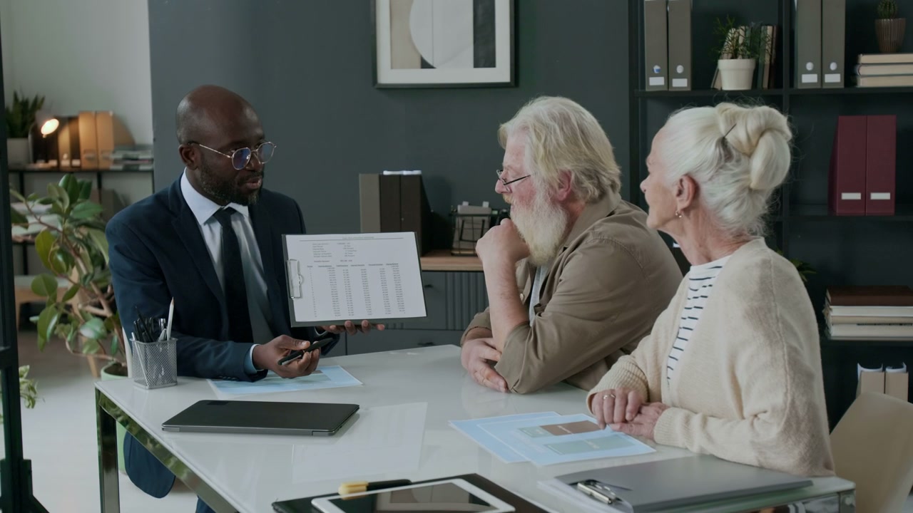 Financial Advisor Discusses Plan with Senior Couple